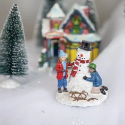 Children Build A Snowman Christmas Village Display